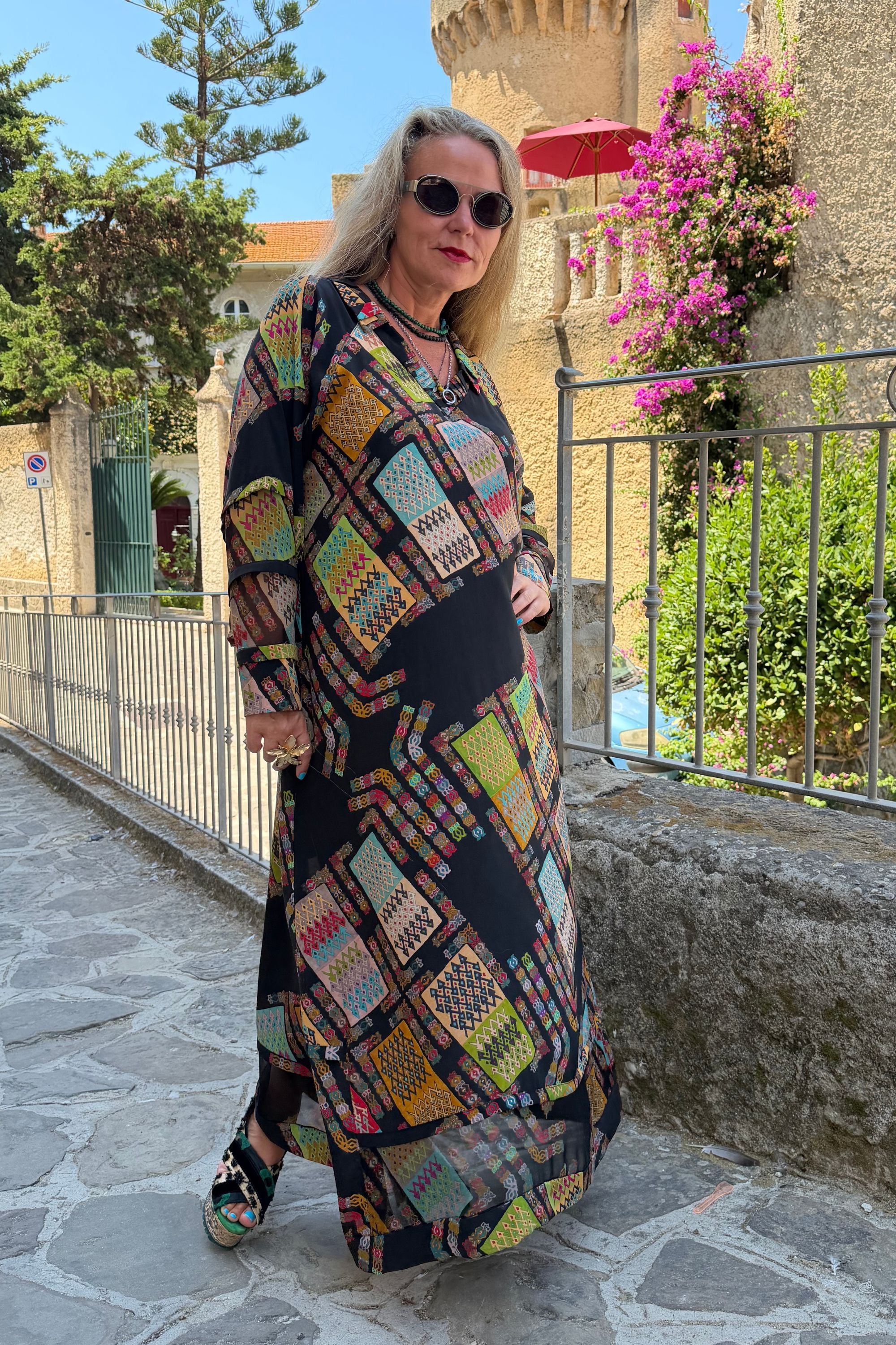 Front view of Andrilla Harly Black dress showing the pointed collar and flowing silk fabric