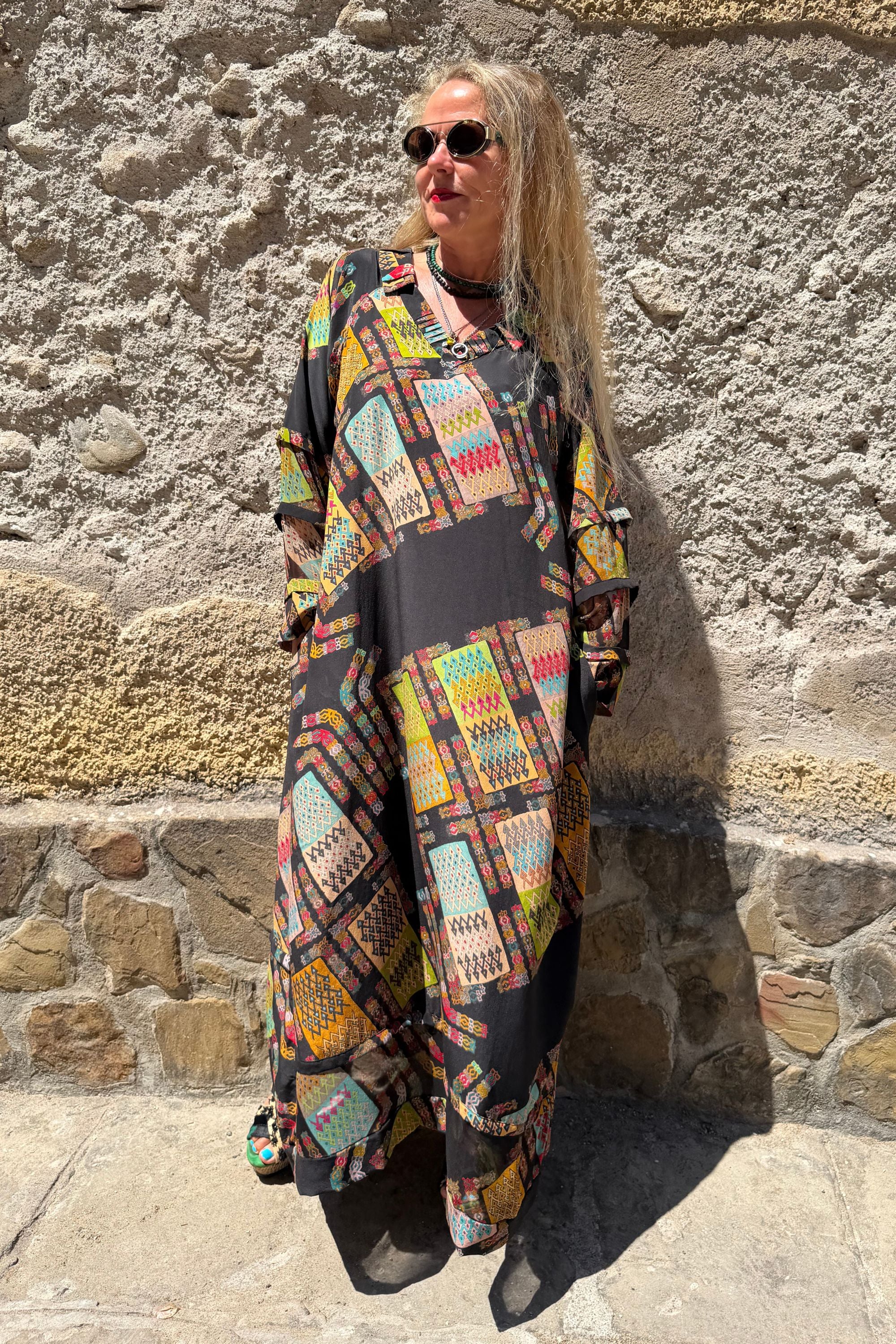 Side view of Andrilla Harly Black silk dress styled outdoors