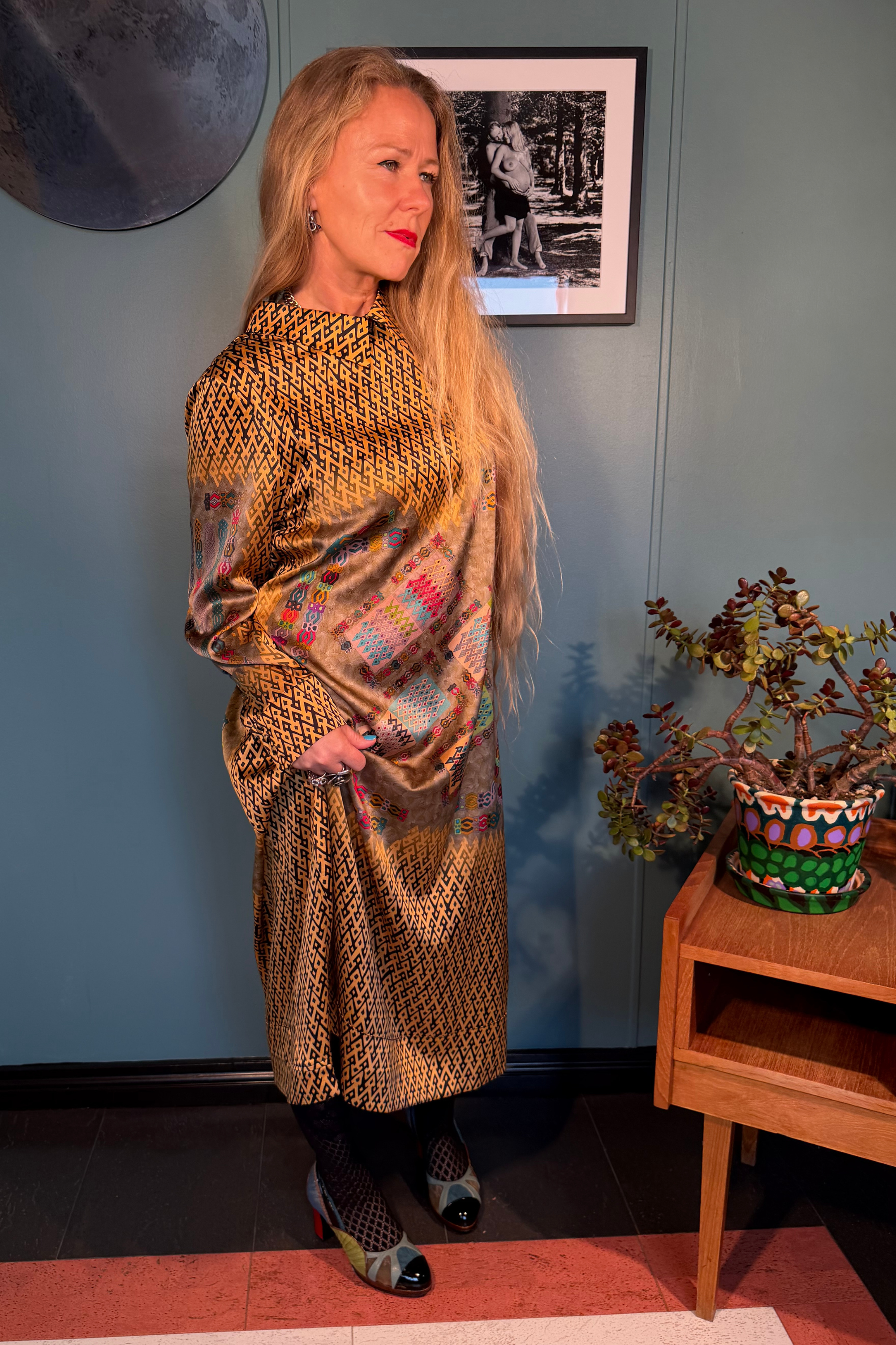 Kron by Kronkron Esme Gold silk satin dress worn full length, showing the A-line silhouette and geometric print