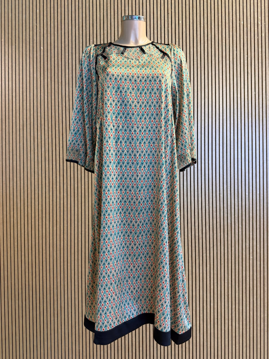 Front view of Kron by Kronkron Jacqueline silk dress in Sporrof Blue with semi-sheer upper panel and dark contrast trim