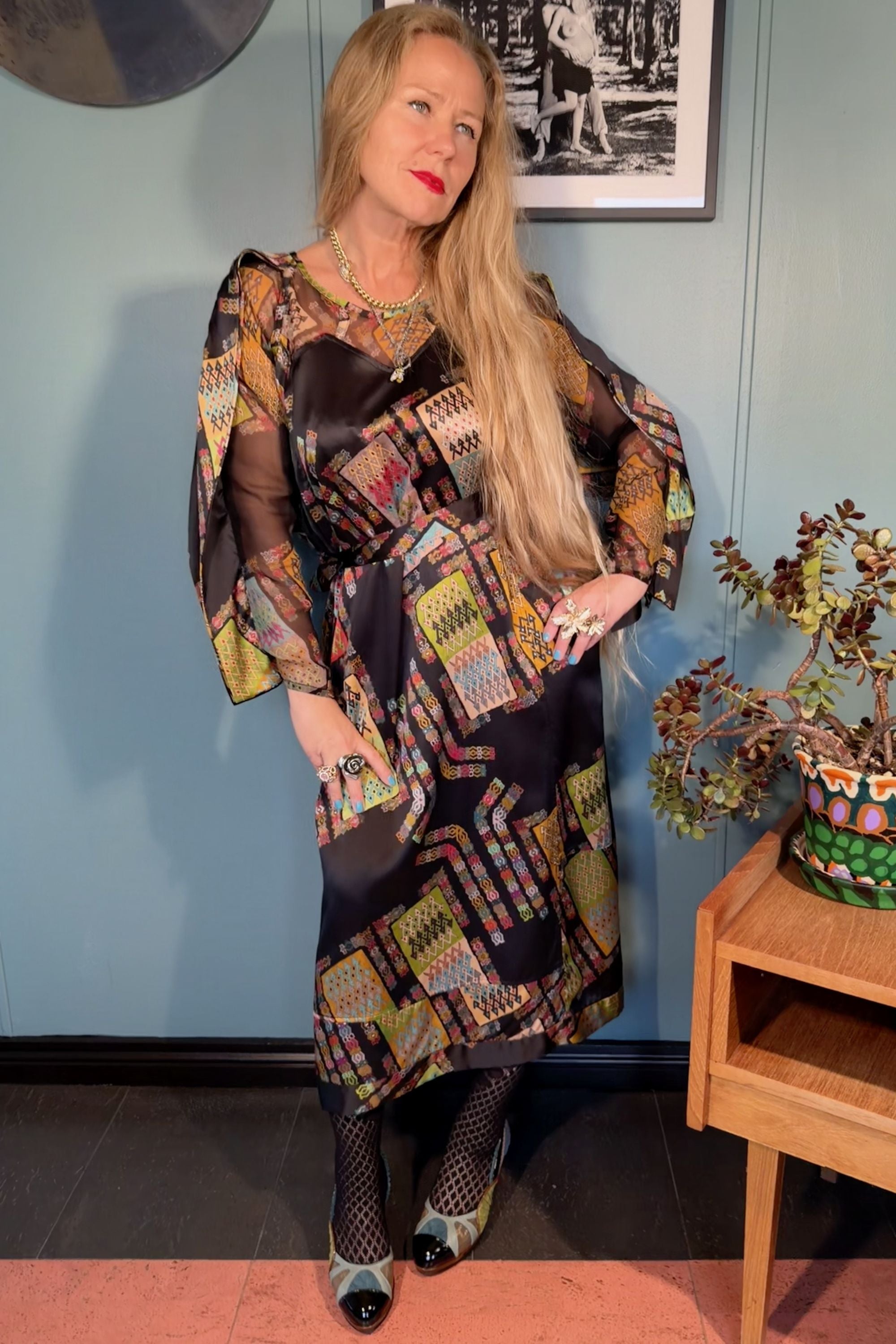 Woman wearing the Josephine silk dress in Harly Black print by Kron by Kronkron, full front view with tied waist belt