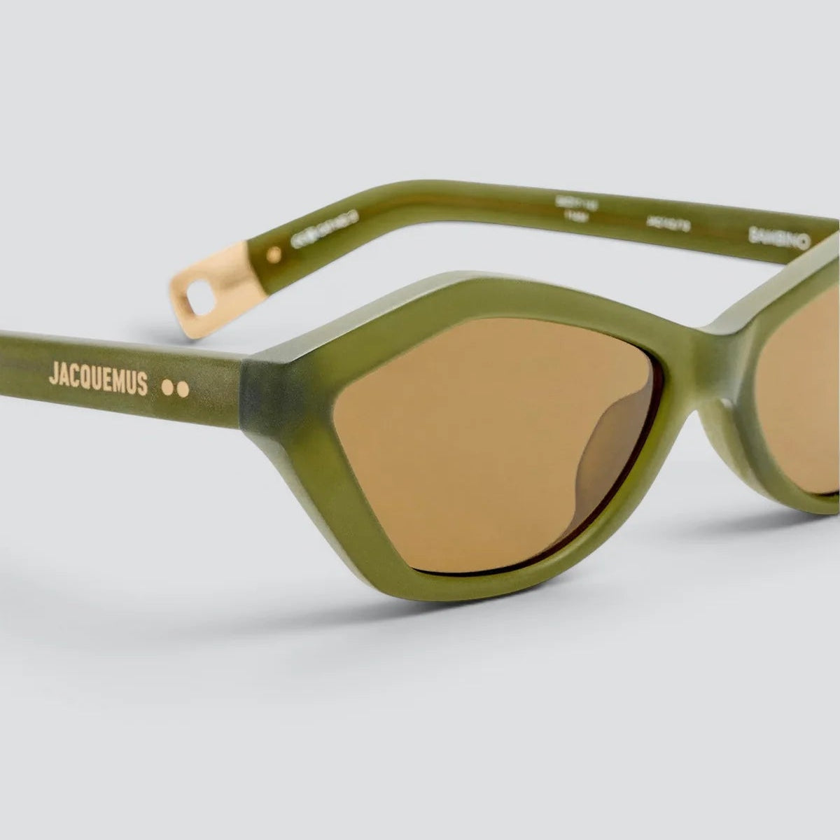 Close-up of Jacquemus Bambino sanded green acetate frame and brown lens