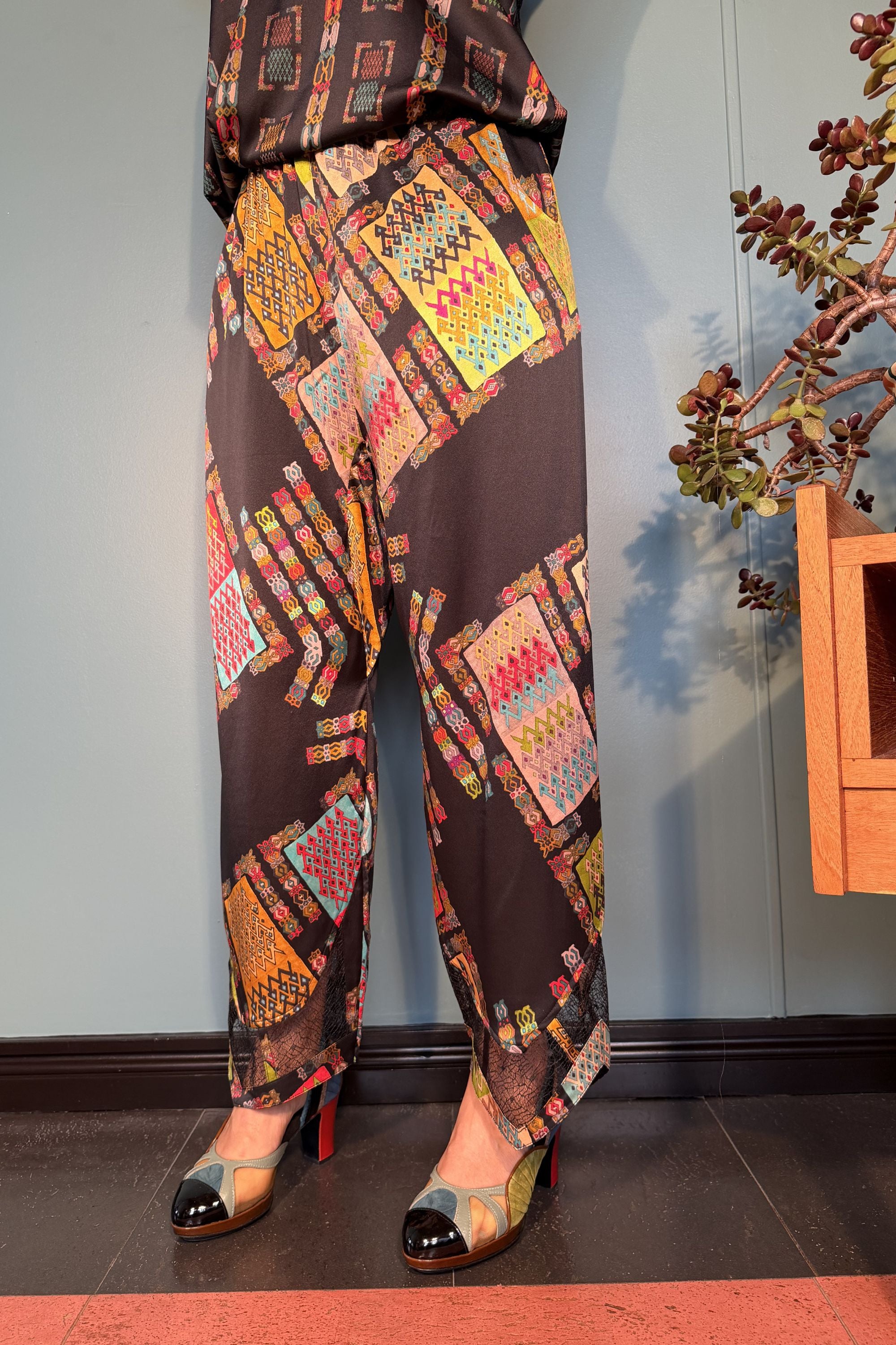 Front view of Zahara silk satin trousers in Harly Black by Kron by Kronkron