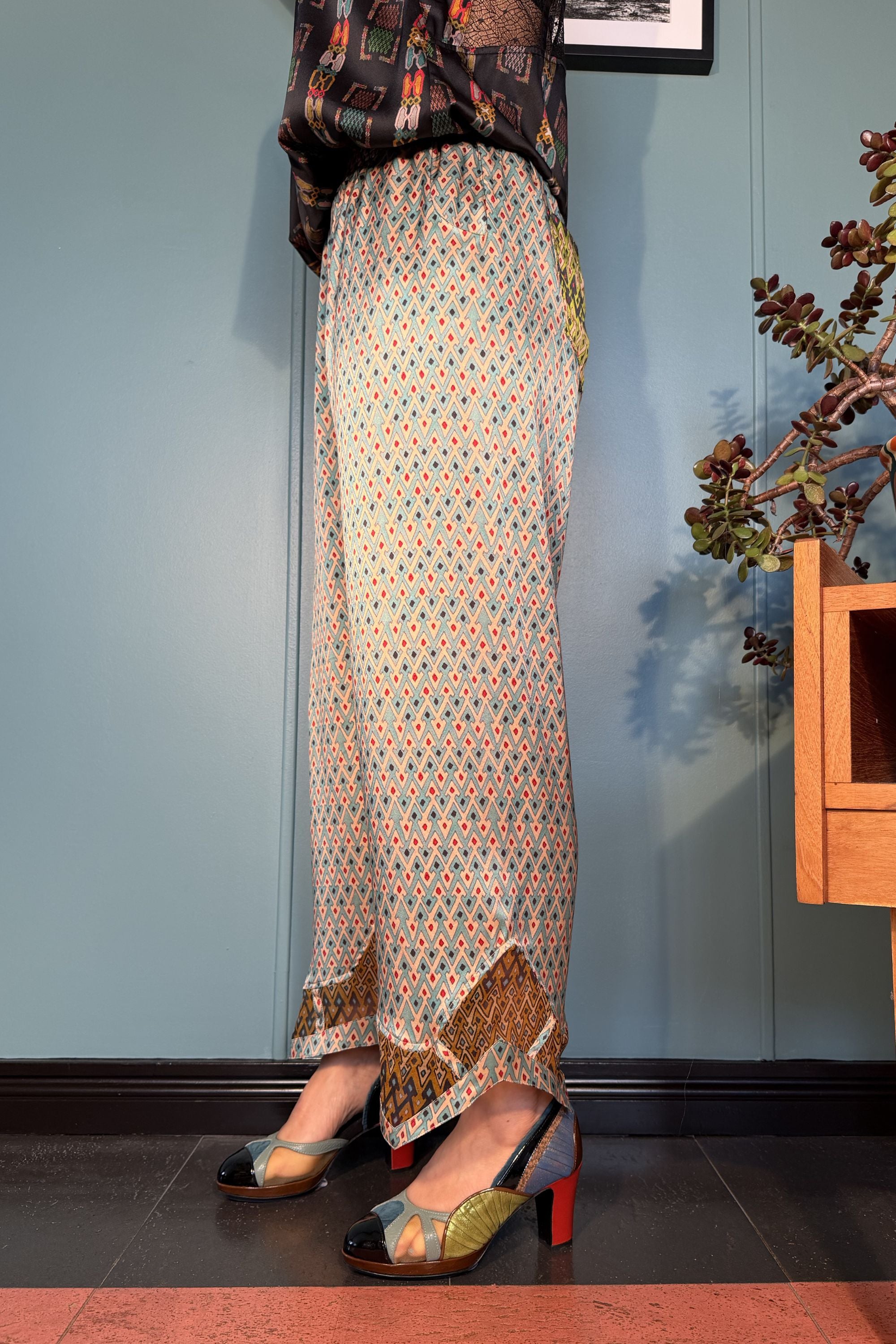 Side view of Zahara silk satin trousers in Sporrof Blue by Kron by Kronkron
