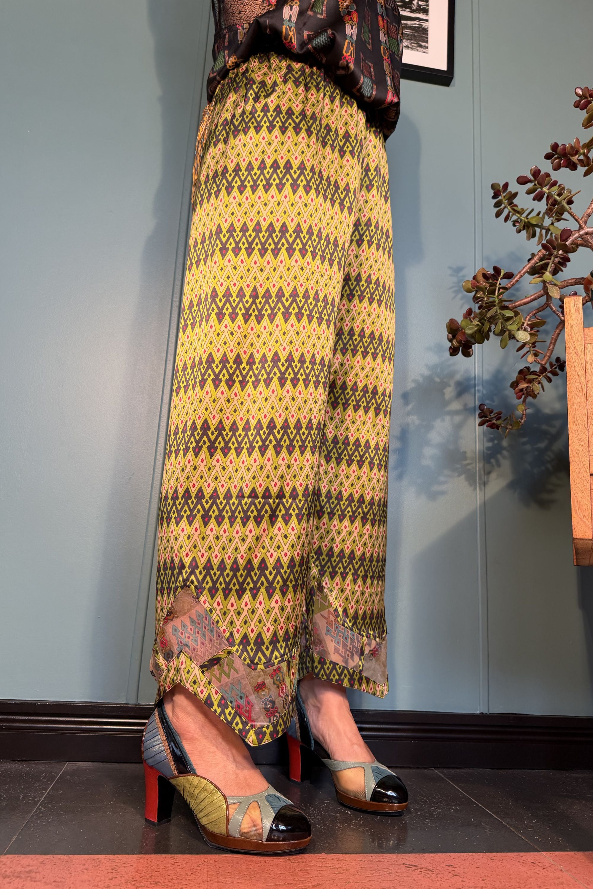 Side view of Zahara silk satin trousers in Sporrof Green by Kron by Kronkron