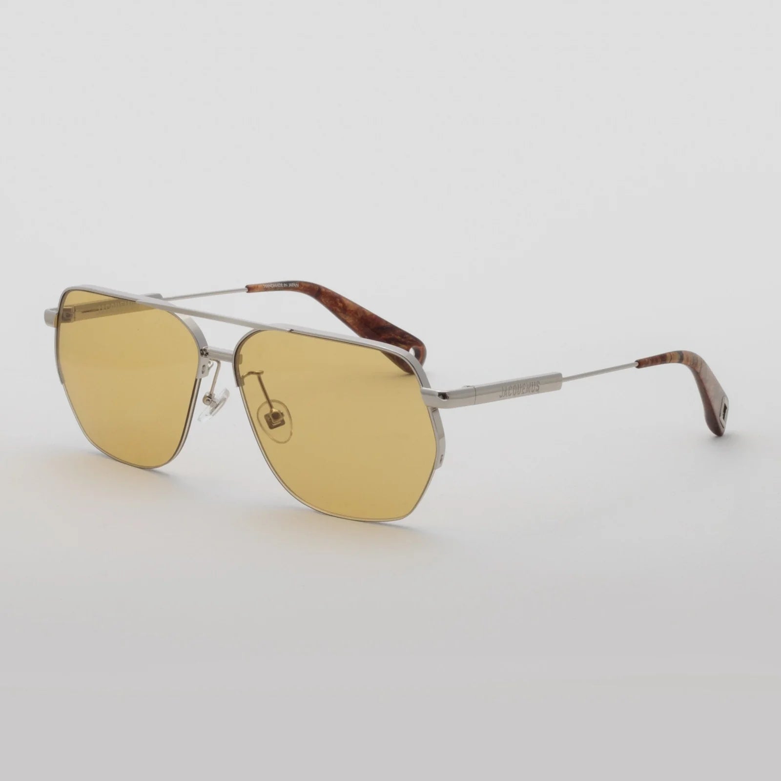 Jacquemus Aviador sunglasses with silver metal frame, yellow lenses and brown temple tips