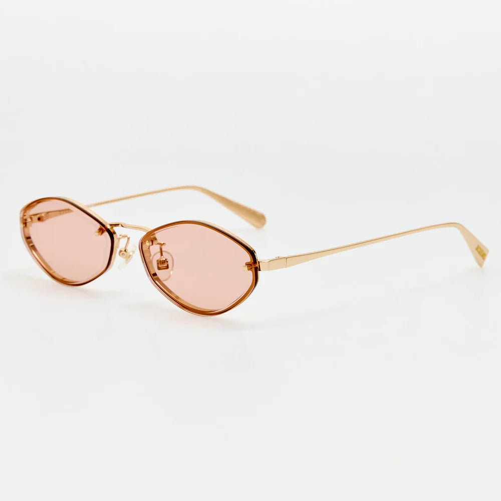 Angled view of Jacquemus Bellini sunglasses in light gold and blush