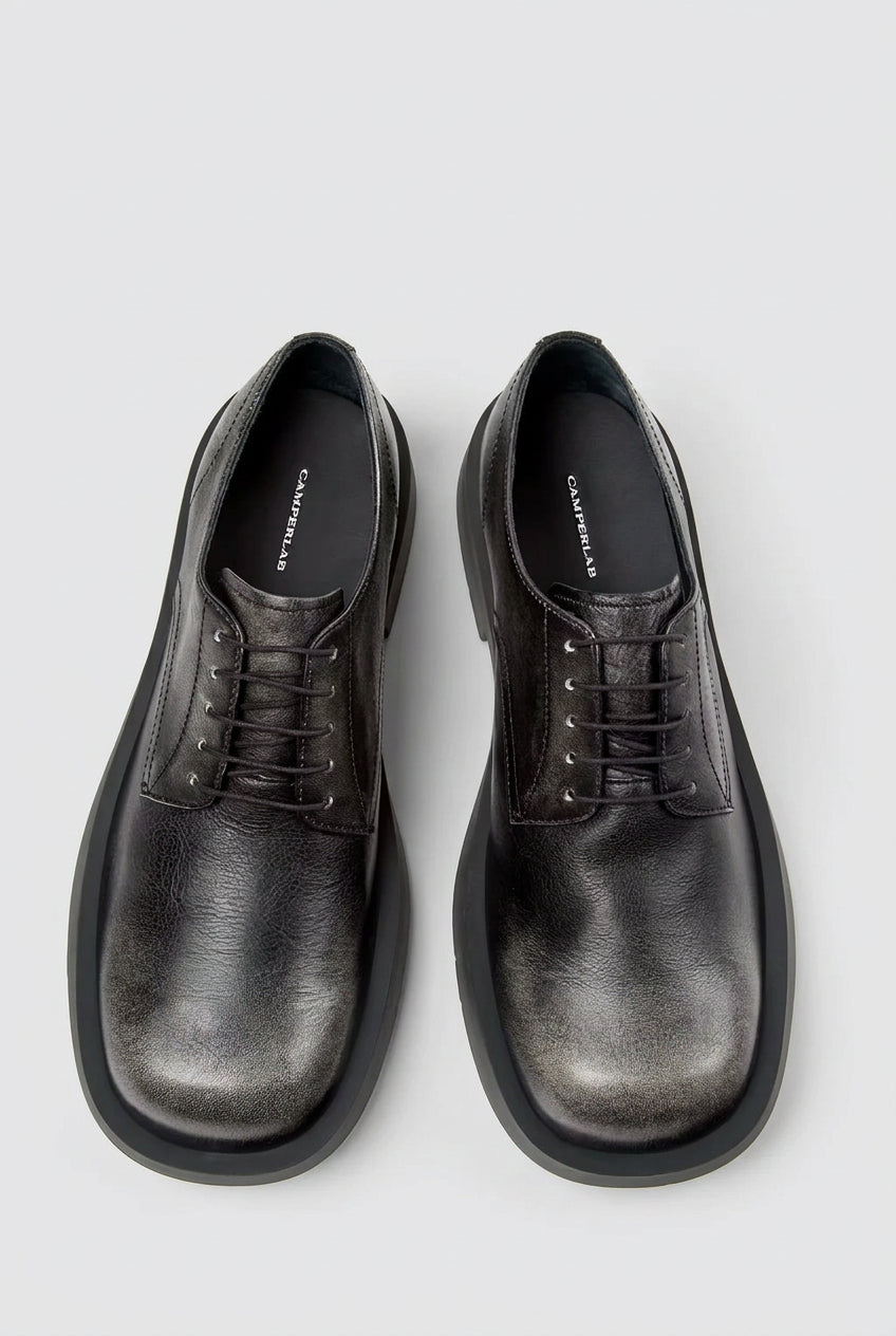 Top view of CamperLab MIL 1978 black and white leather lace-up shoes