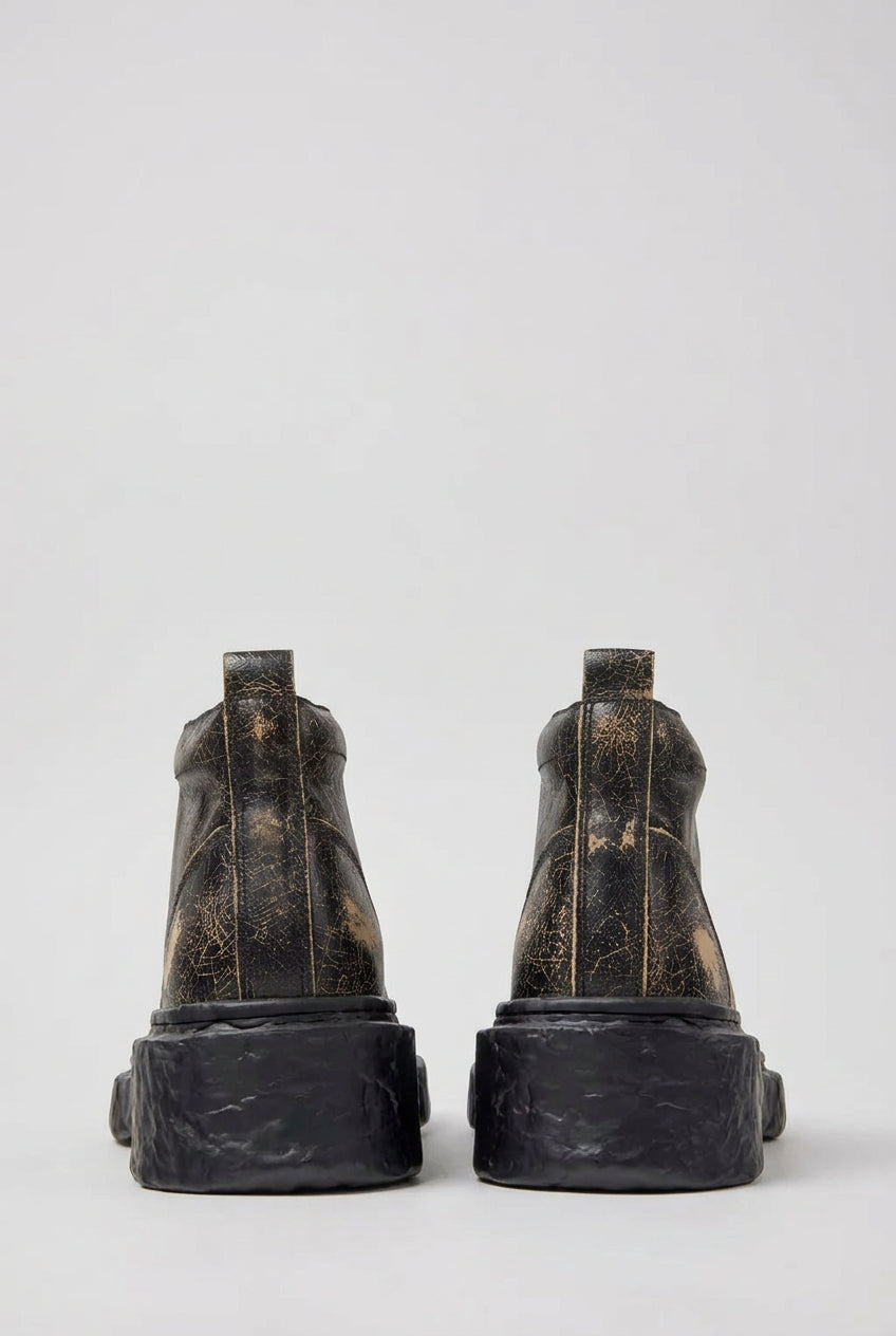 Rear view of CamperLab Vamonos black and brown leather ankle boots