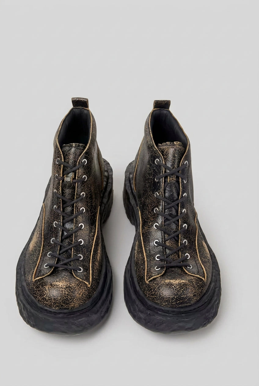 Top view of CamperLab Vamonos black and brown leather ankle boots