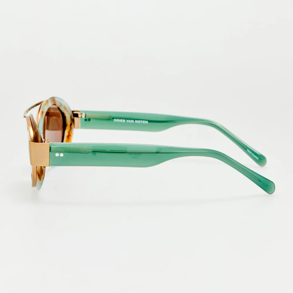 Side view of Dries Van Noten sunglasses showing translucent aqua temples and gold-tone details