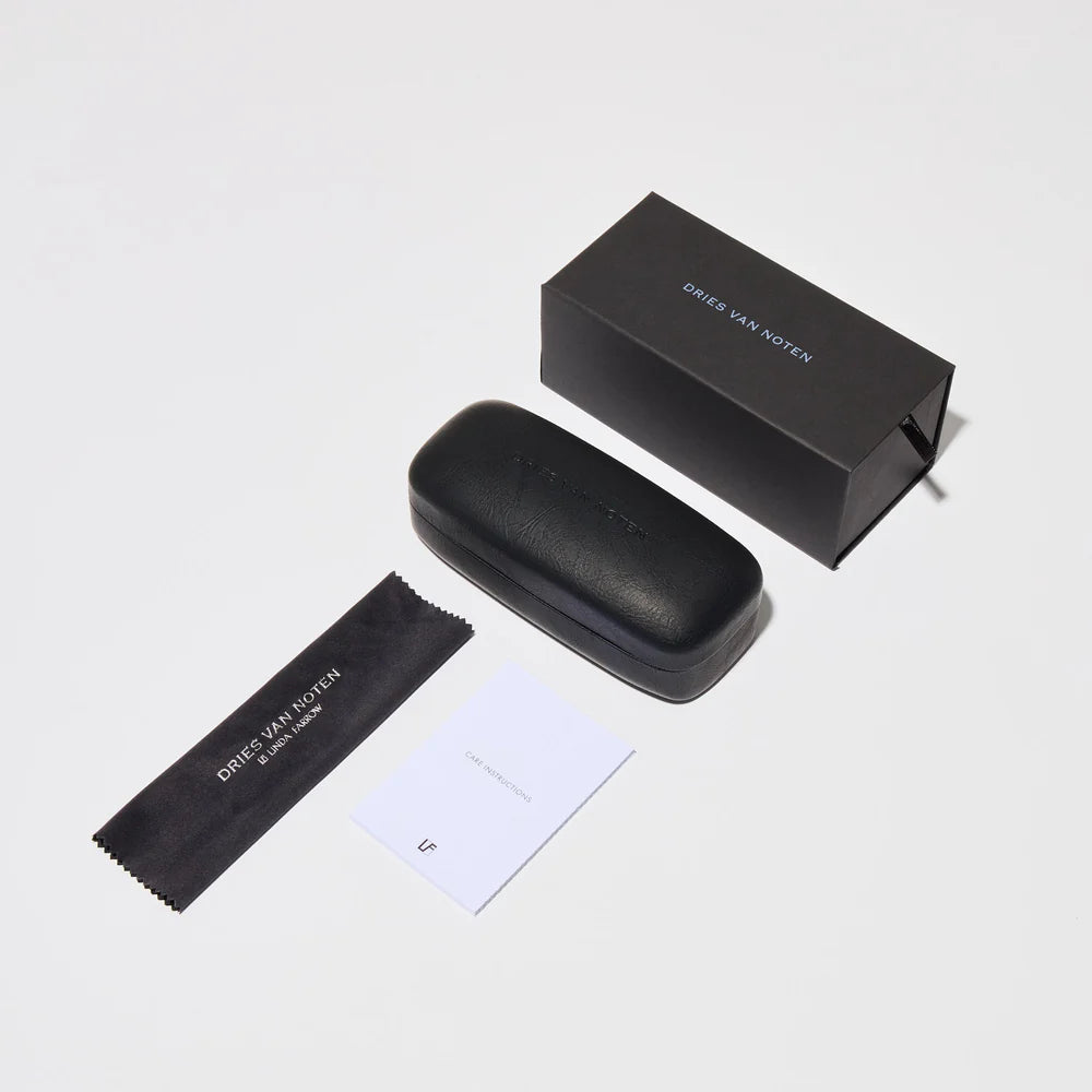 Dries Van Noten sunglasses packaging with branded box, hard case, cleaning cloth and care booklet