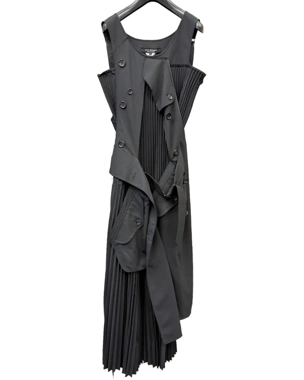 Front view of Junya Watanabe black asymmetric pleated dress with layered harness panels and oversized buttons