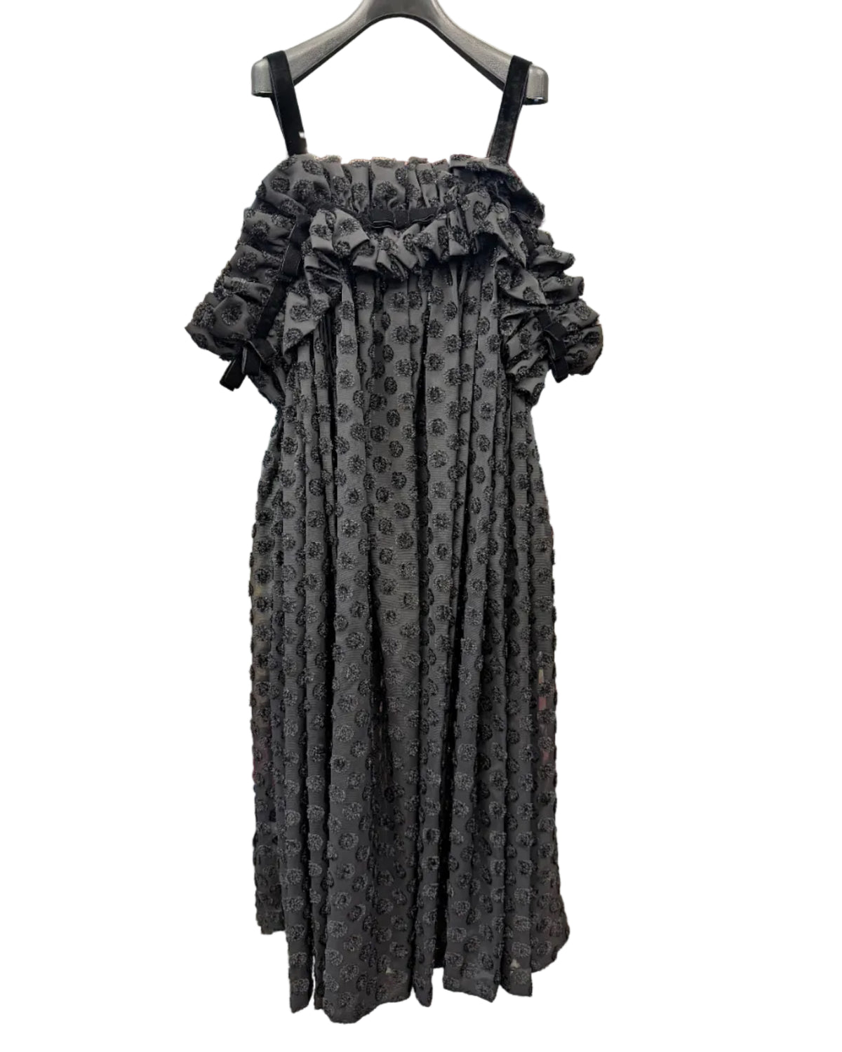 Front view of noir kei ninomiya black textured pleated dress with layered ruffles and slim shoulder straps
