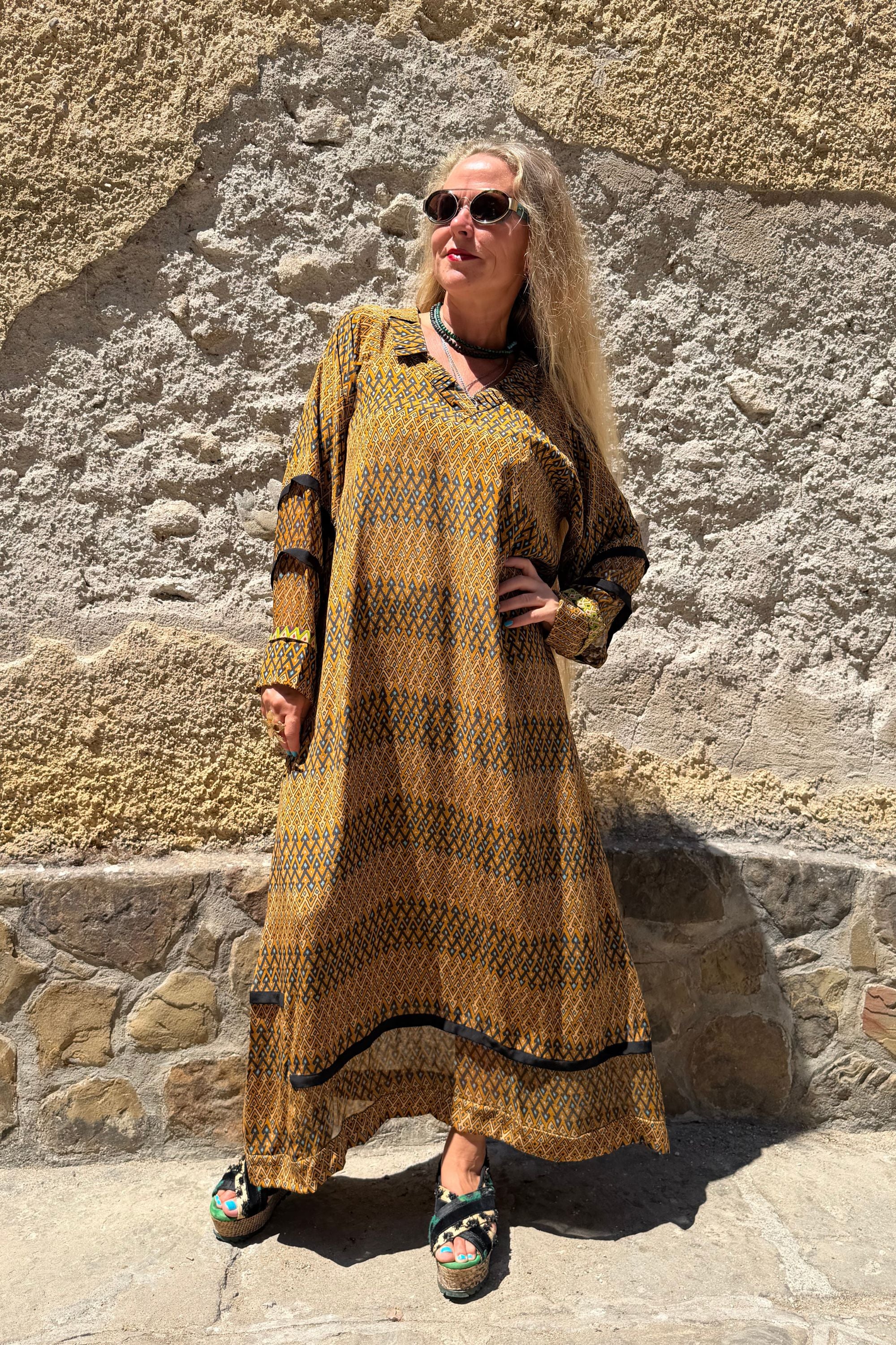 Front view of Andrilla silk dress in Sporrof Brown with pointed collar, side pockets and semi-sheer hem