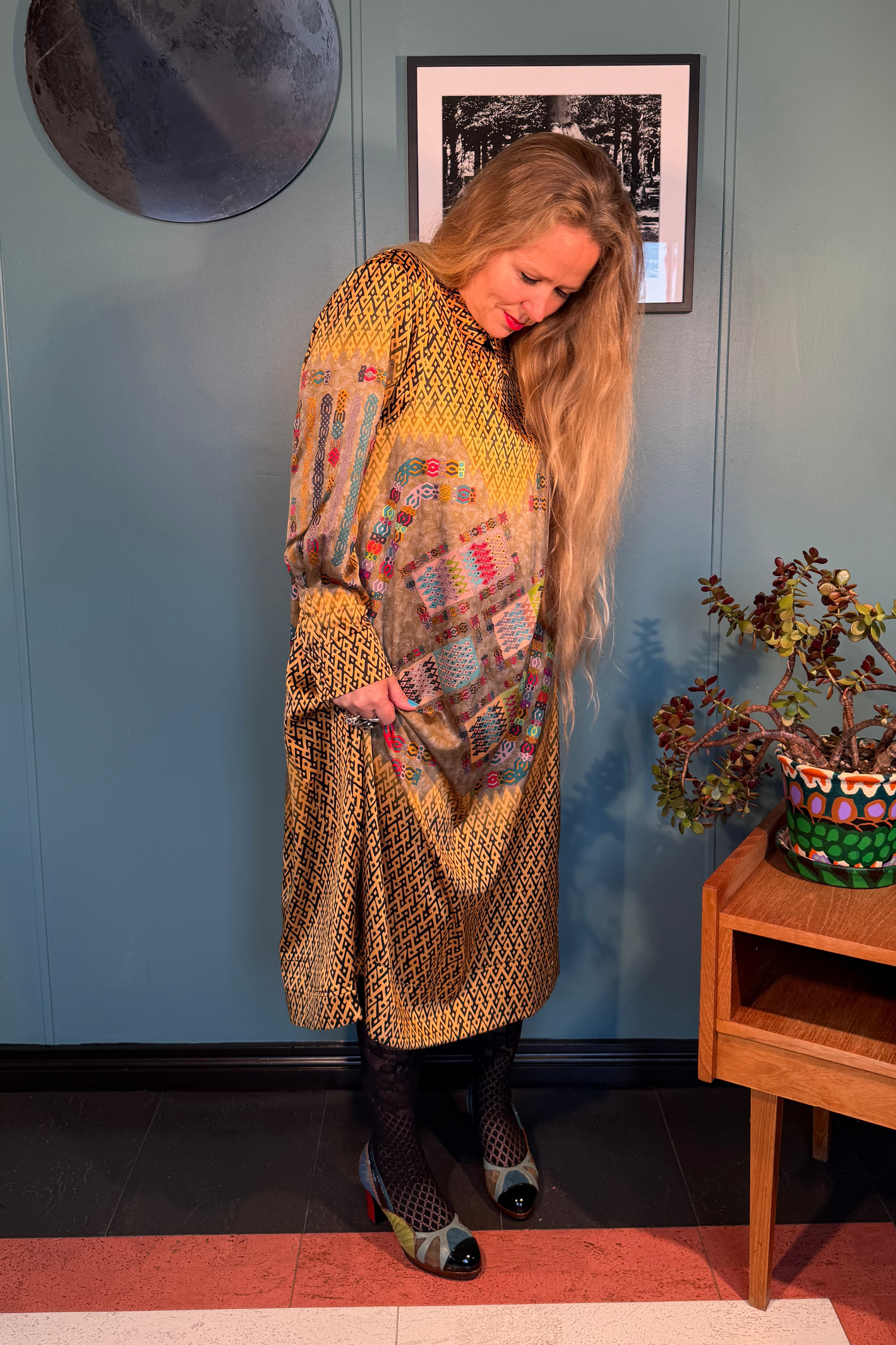 Kron by Kronkron Esme Gold silk satin dress worn from the front, showing the mid-calf length and long sleeves