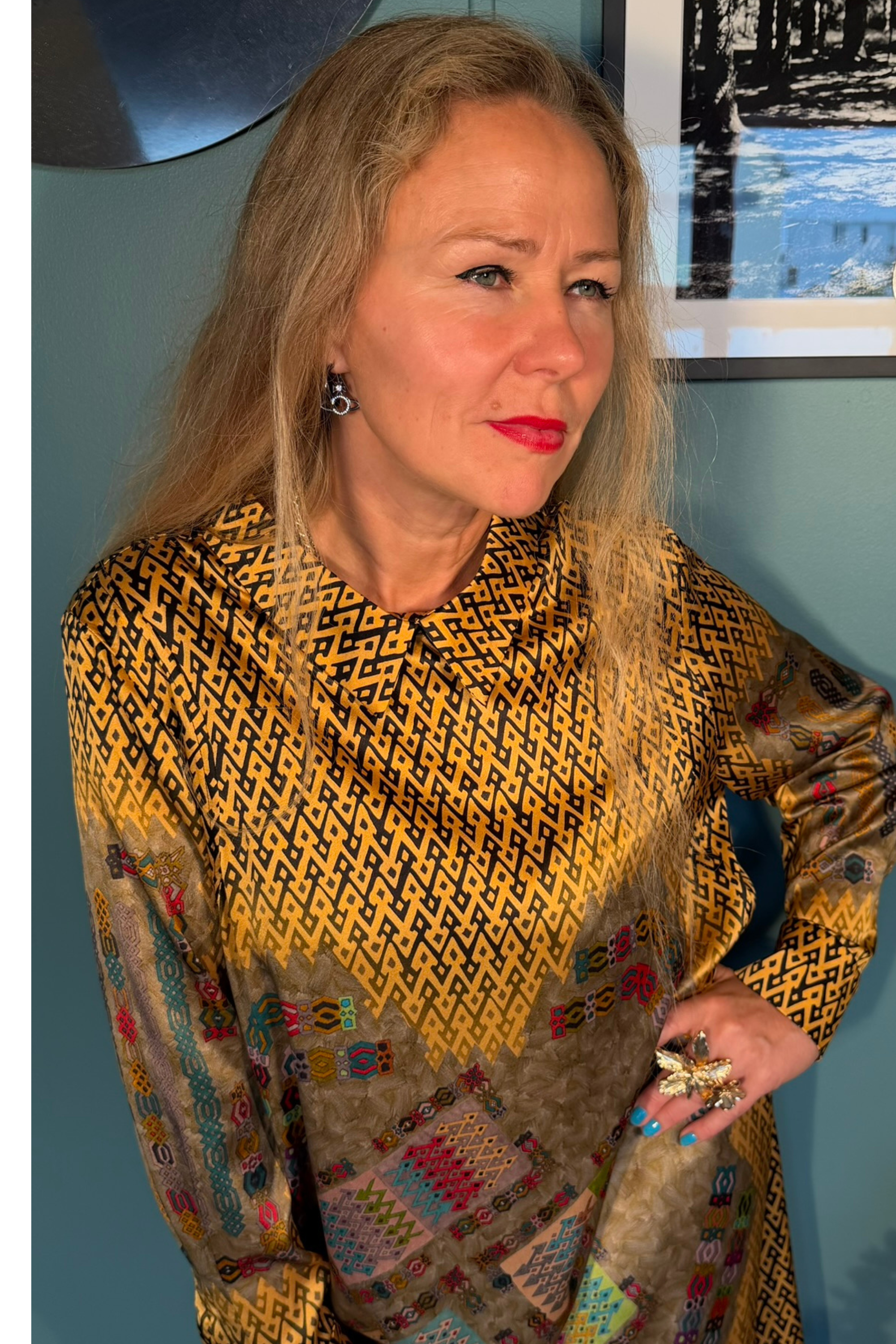 Close-up of Kron by Kronkron Esme Gold dress showing the pointed collar, silk satin sheen and patterned bodice