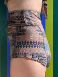 Kron by Kronkron Dita Highrise Bikini Bottom in Ljósrof print worn as a high-rise bikini bottom