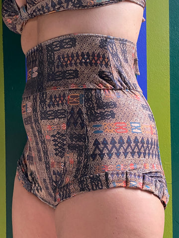 Kron by Kronkron Dita Highrise Bikini Bottom in Ljósrof print worn as a high-rise bikini bottom 