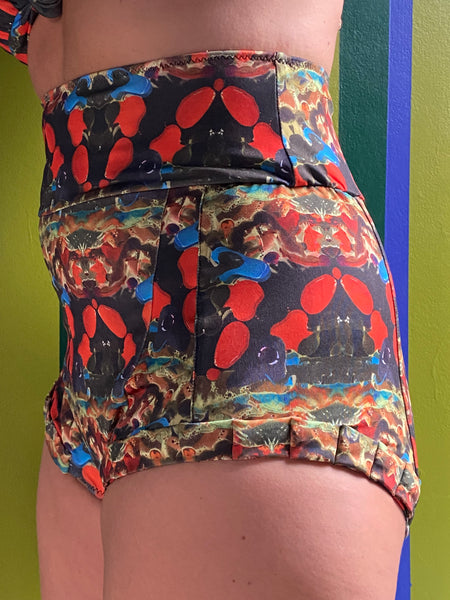 Kron by Kronkron Dita Highrise Bikini Bottom in Daggdís print worn as a high-rise bikini bottom