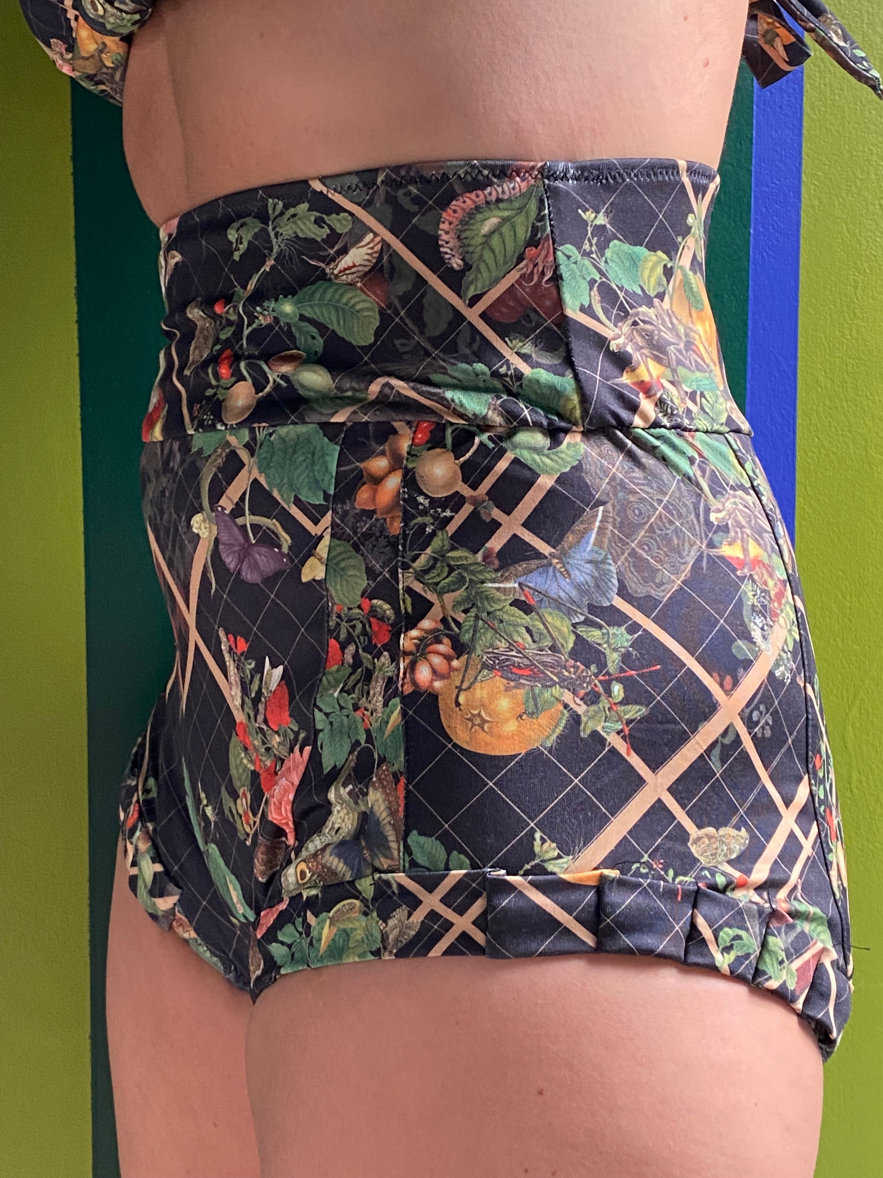 Kron by Kronkron Dita Highrise Bikini Bottom in House of Bug print worn as a high-rise bikini bottom