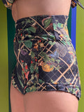 Kron by Kronkron Dita Highrise Bikini Bottom in House of Bug print worn as a high-rise bikini bottom