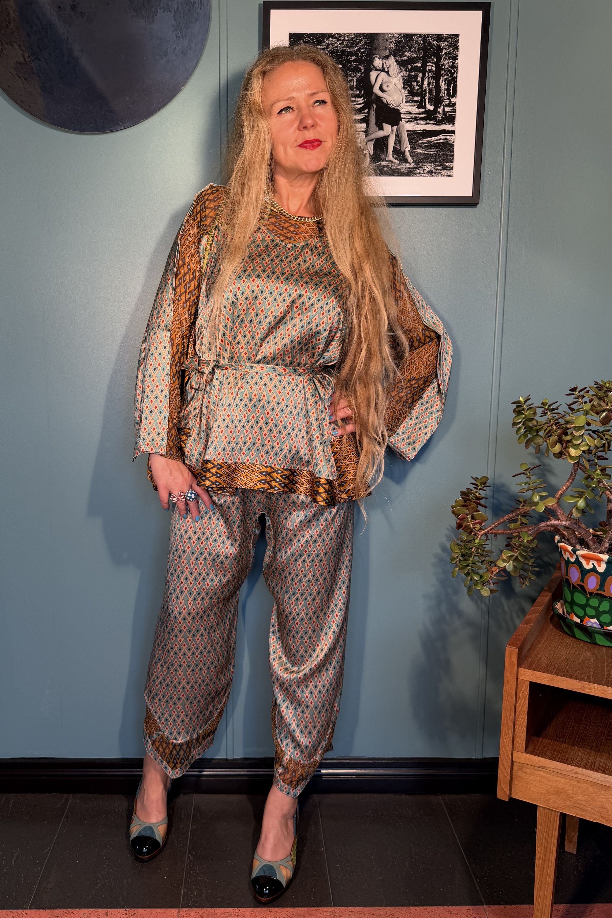 Model wearing the Kron by Kronkron Josephine silk blouse and matching trousers in Sporrof Blue