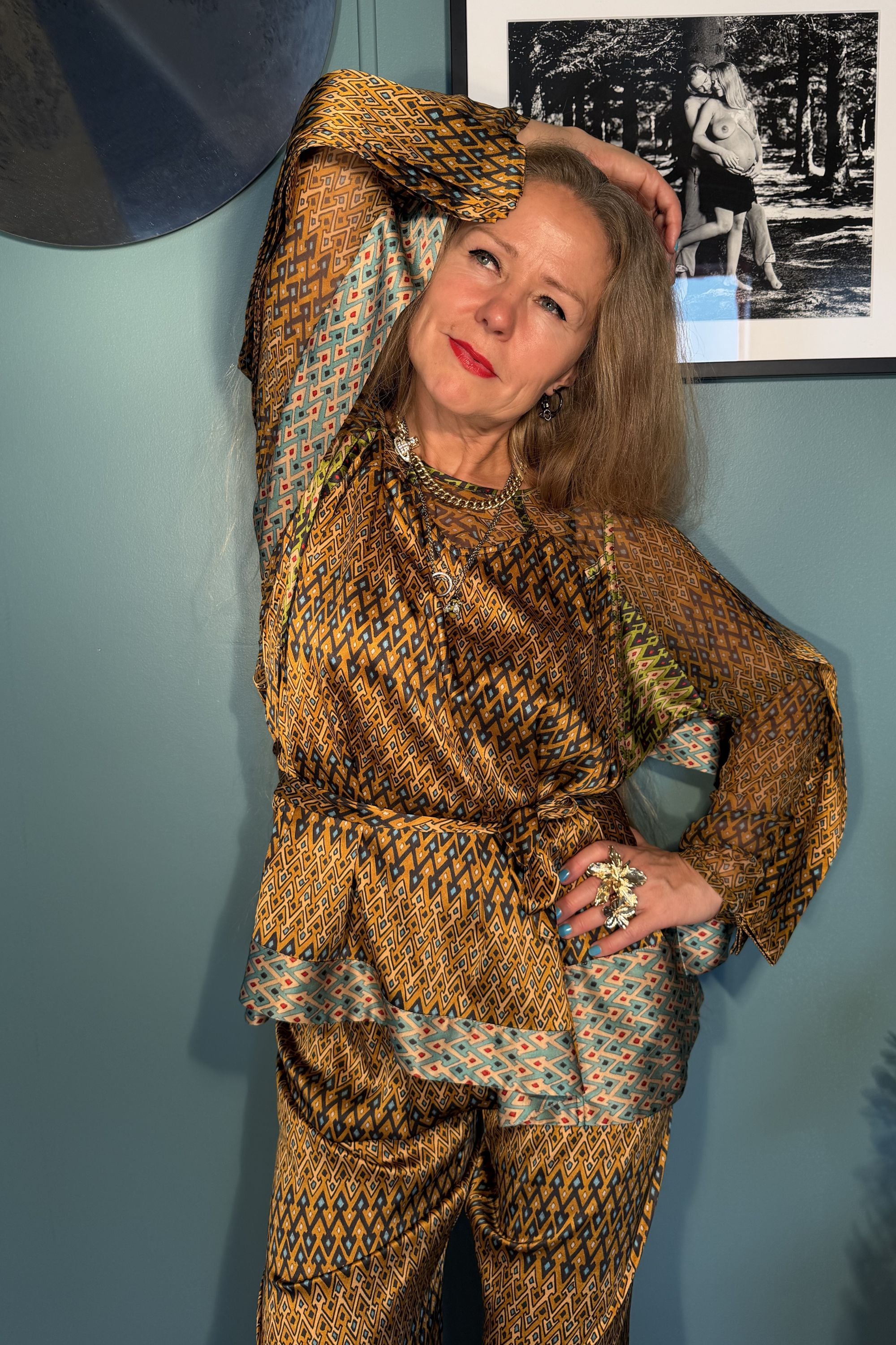 Model wearing Josephine Sporrof Brown silk blouse with tie belt and matching trousers