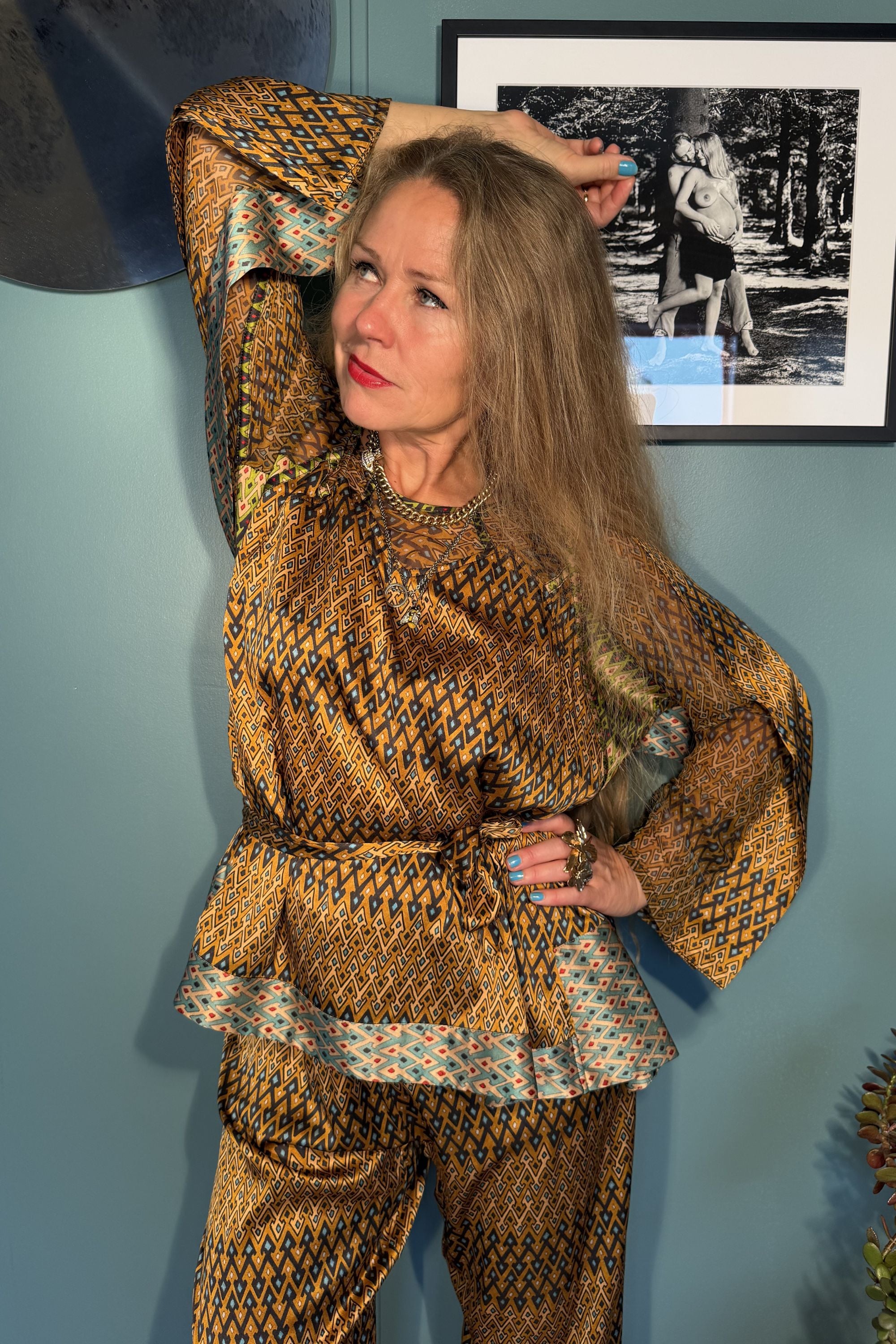 Model wearing Josephine Sporrof Brown silk blouse with tie belt and matching trousers