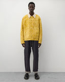 Full look
Junya Watanabe Man Floral Pattern Jacket in yellow styled with dark denim and black leather shoes