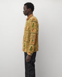 Worn side
Junya Watanabe Man Plant Pot Tapestry Jacket in brown shown from the side with elbow patch detail