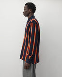Side worn
Junya Watanabe Man Striped Knit Polo in navy and orange shown from the side