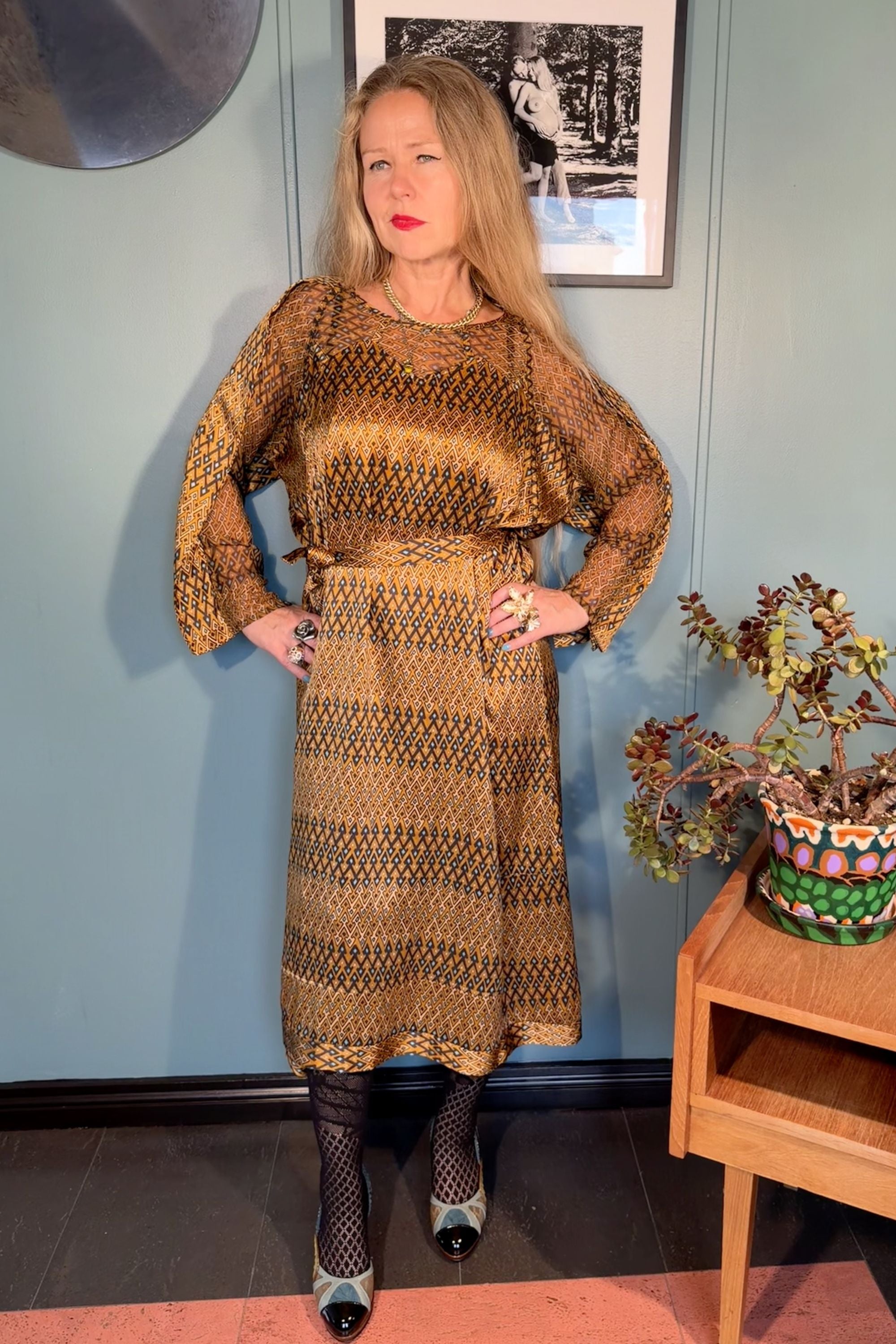 Front view of the Josephine Sporrof Gold silk satin midi dress by Kron by Kronkron with long sleeves and a defined waist