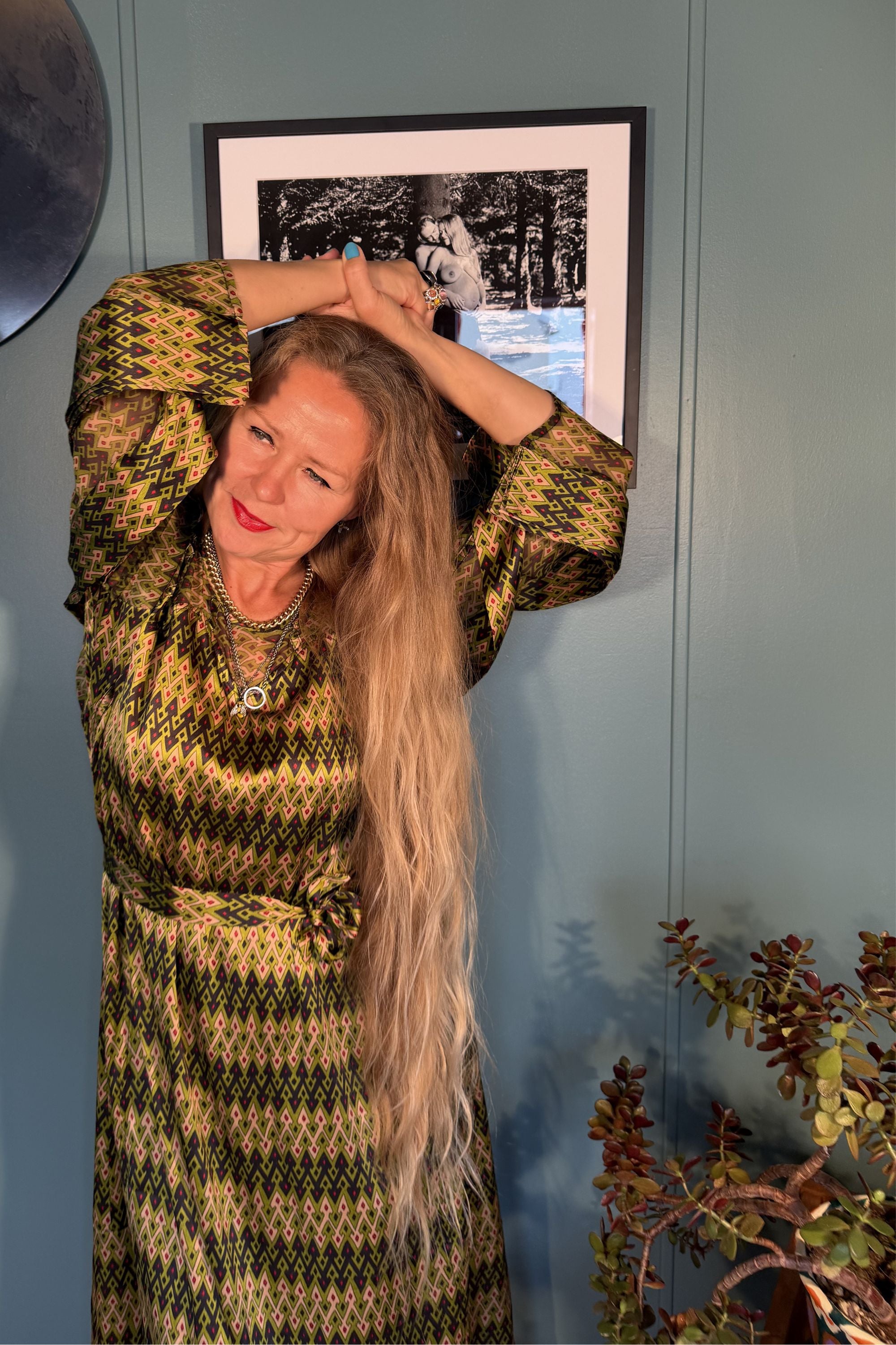 Close-up of the Josephine Sporrof Green dress showing the geometric silk print and voluminous sleeves