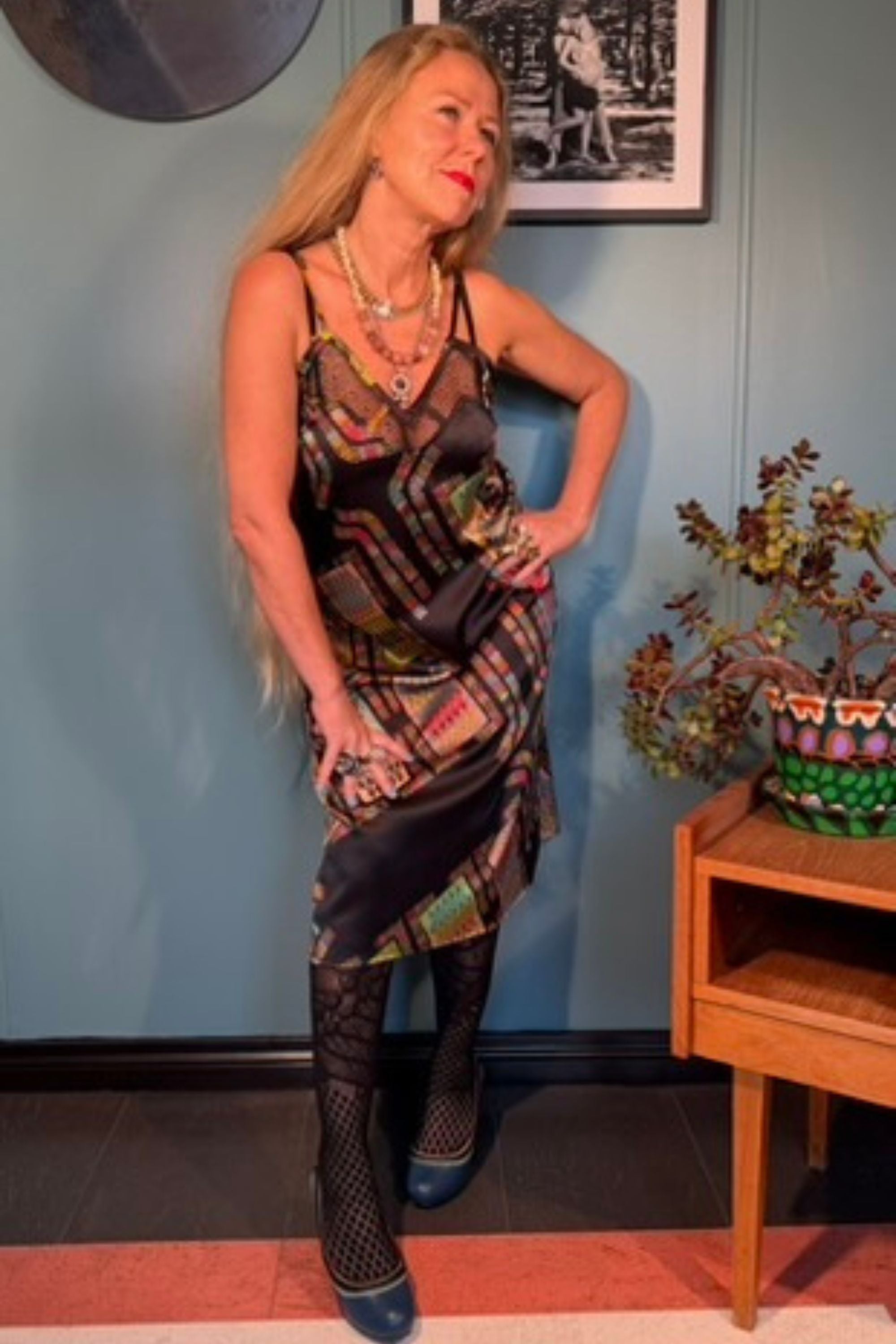 Woman wearing the Norma Lang silk slip dress in Harly Black print by Kron by Kronkron, front three-quarter view