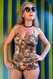 Kron by Kronkron Pam Long Bikini Top in Treasurehunt print worn with matching bikini bottoms against a striped green and blue background