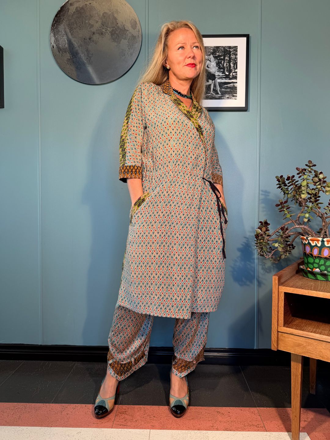 Front view of Rimini Sporrof Multi silk dress styled with matching trousers, showing side pockets and relaxed midi silhouette