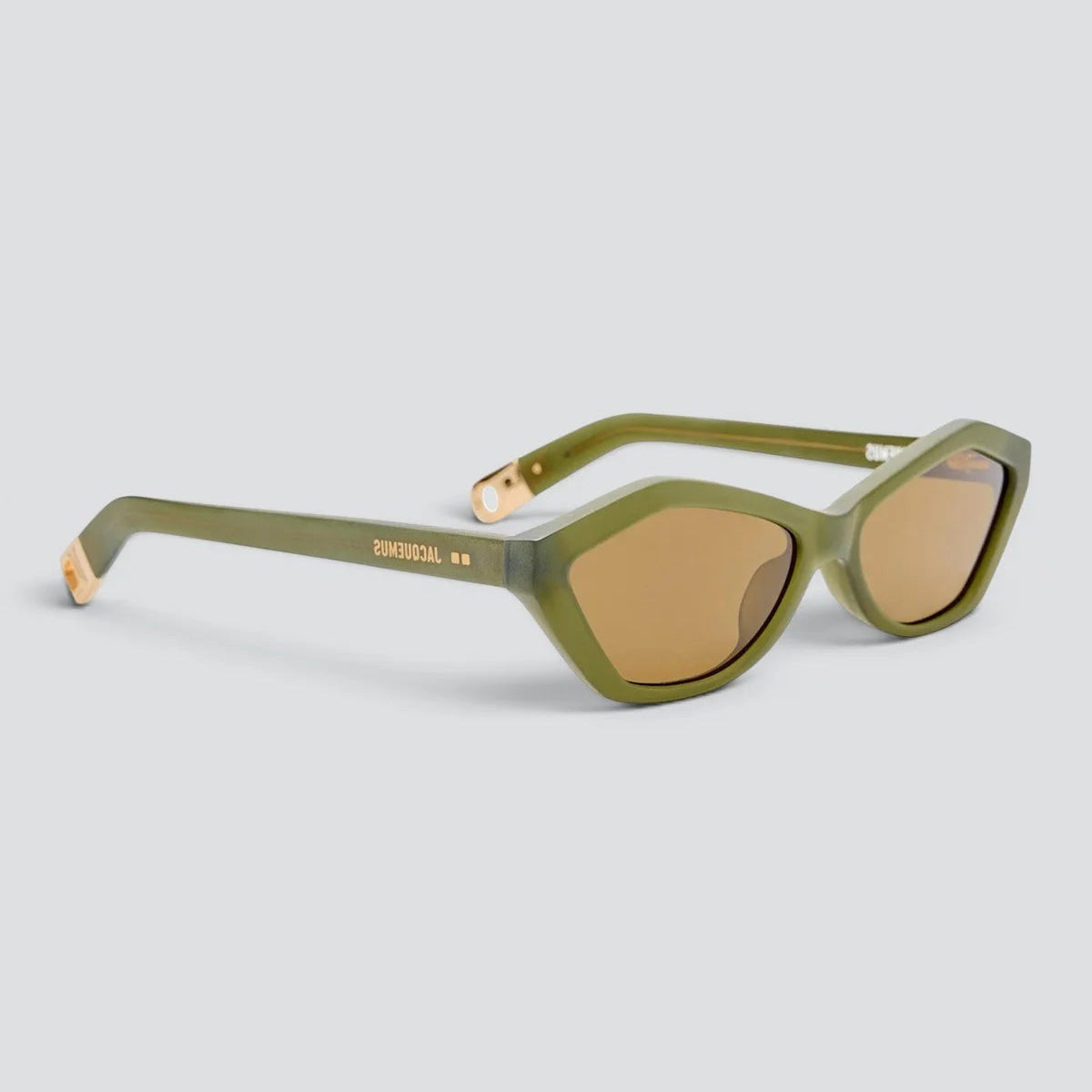 Angled view of Jacquemus Bambino sunglasses in sanded green, light gold and brown