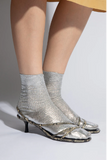 Maria La Rosa One Ribbed Laminated Silver ribbed silk socks worn with metallic silver heels