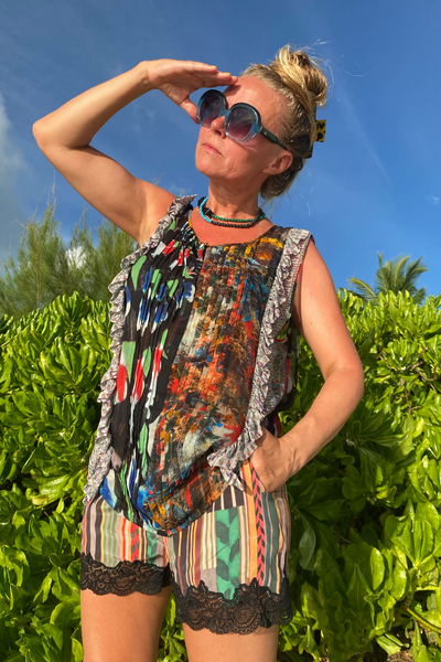 Kron by Kronkron Zaha Shorts Stripe silk shorts with lace trim styled with a printed top outdoors