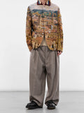 Junya Watanabe Man Distressed Cityscape Knit Jacket in beige styled with relaxed tailored trousers and black shoes
