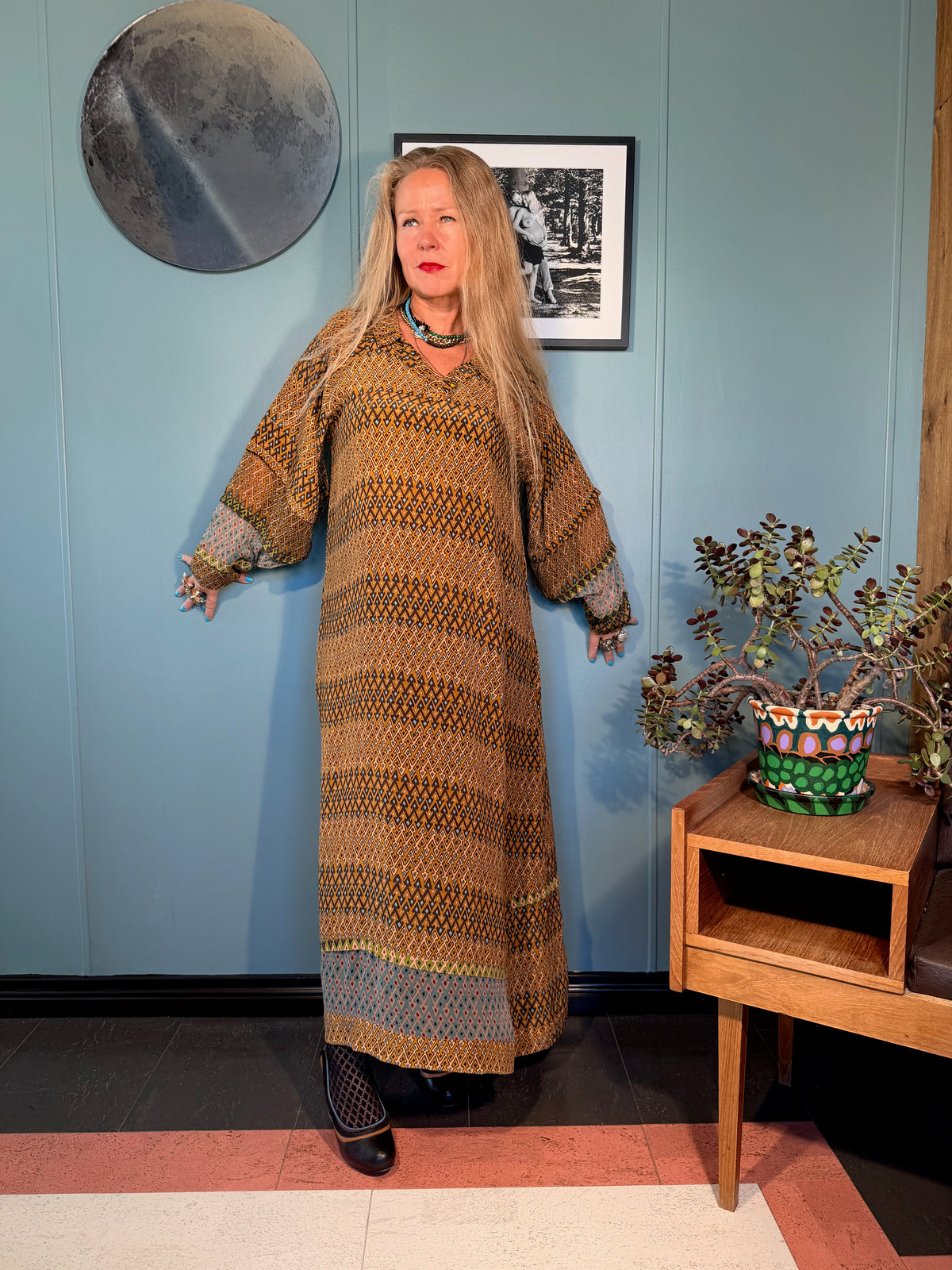 Three-quarter view of Kron by Kronkron Andrilla dress in Sporrof Brown & Blue with pointed collar and geometric silk print