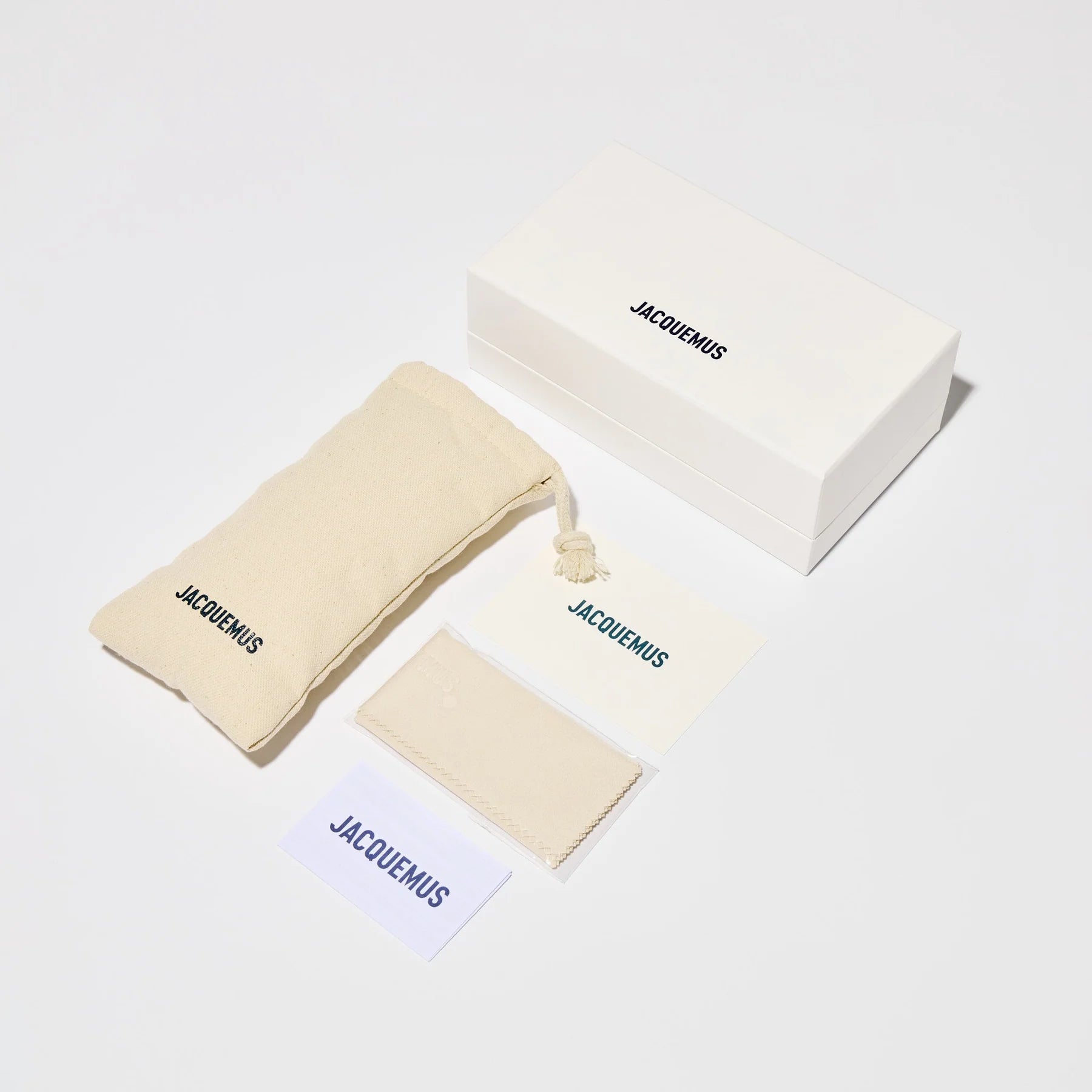 Jacquemus sunglasses packaging with branded box, pouch, cleaning cloth and authenticity cards