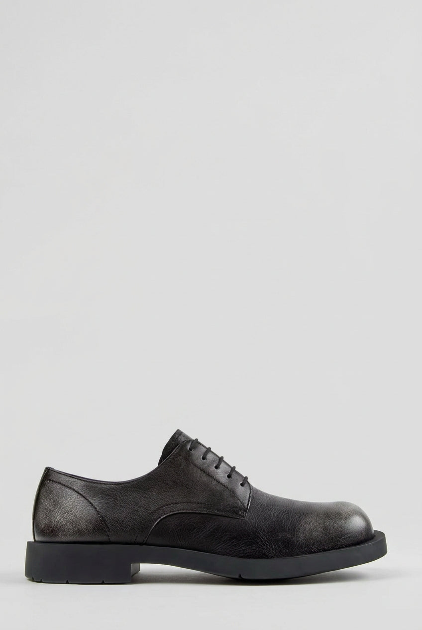 Side view of CamperLab MIL 1978 black and white leather lace-up shoes