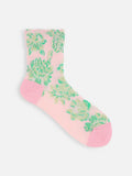 Tabio Float Flowers Low Crew Socks in pink with large green floral pattern and ankle-length shape