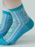 Tabio Sicilian Pattern Low Crew Socks in blue with intricate Sicilian-inspired pattern in pink, yellow and white