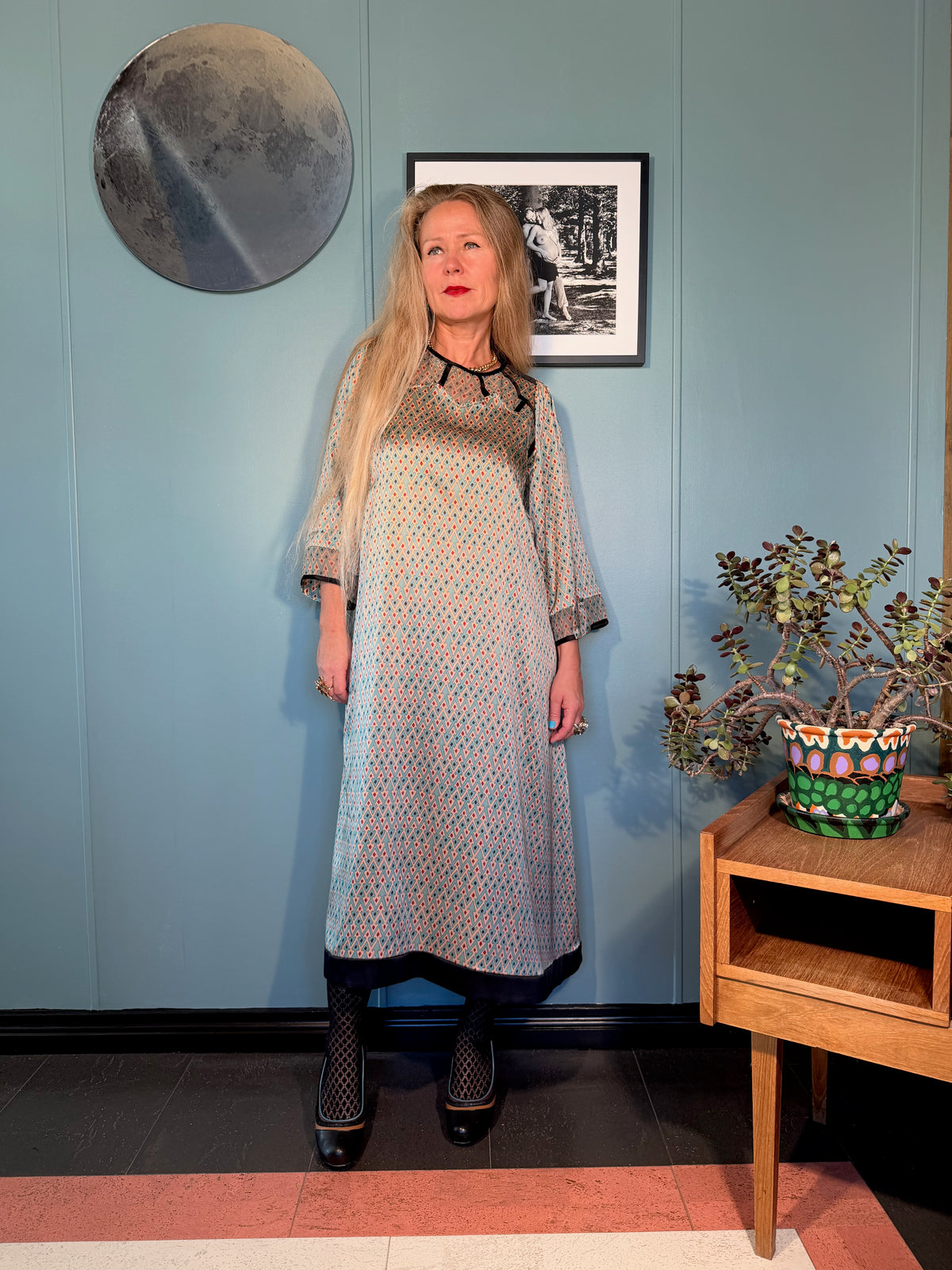 Three-quarter view of Jacqueline silk dress in Sporrof Blue showing the fluid silk drape and semi-sheer neckline detail
