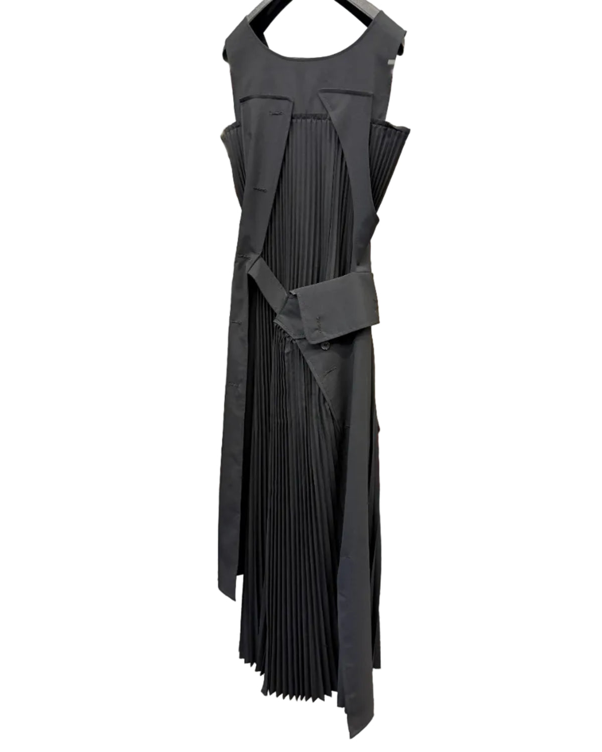 Back view of Junya Watanabe black pleated dress showing asymmetric strap construction and long pleated panels