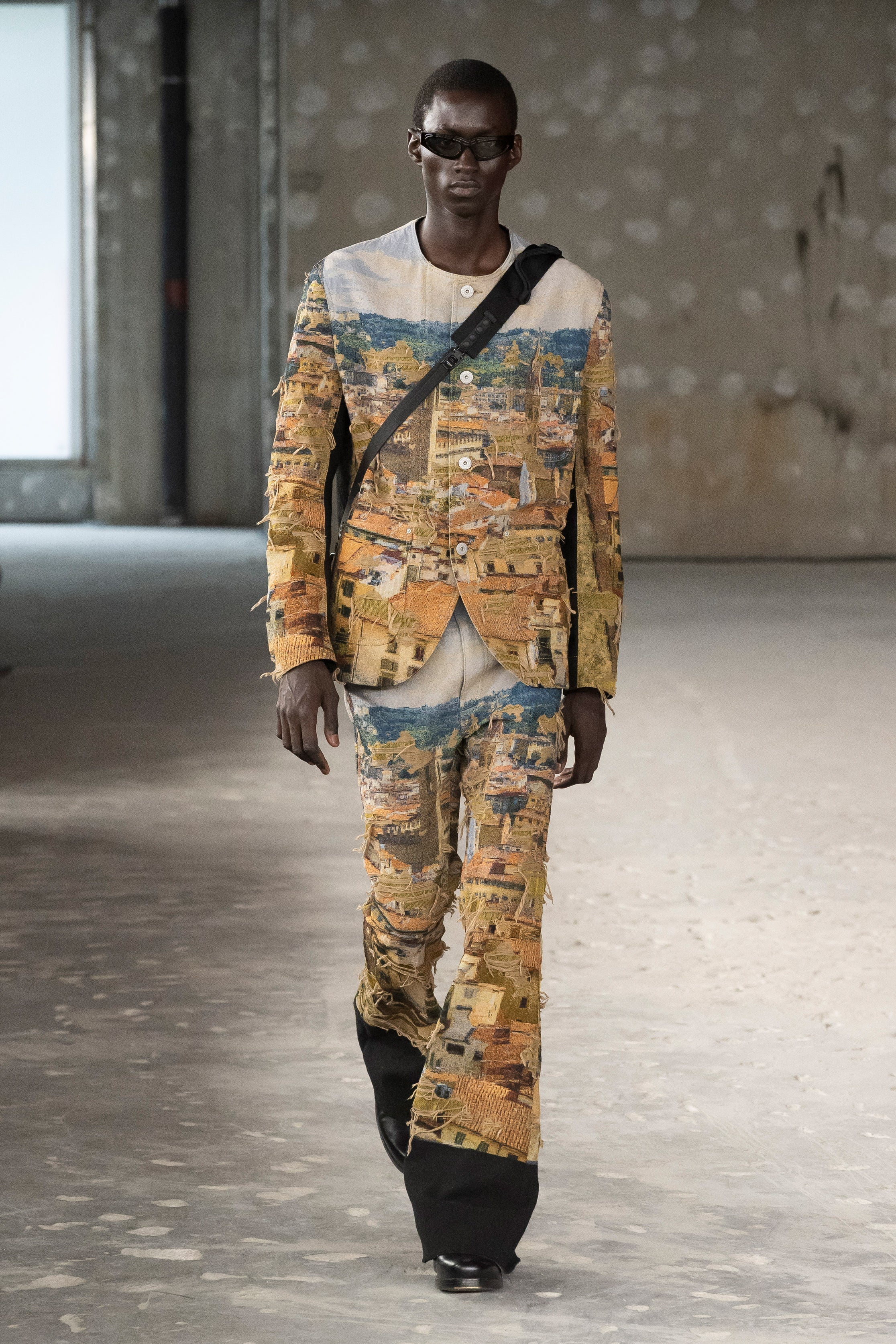 Runway image
Junya Watanabe Man Distressed Cityscape Knit Jacket in beige worn on the runway with matching textured trousers