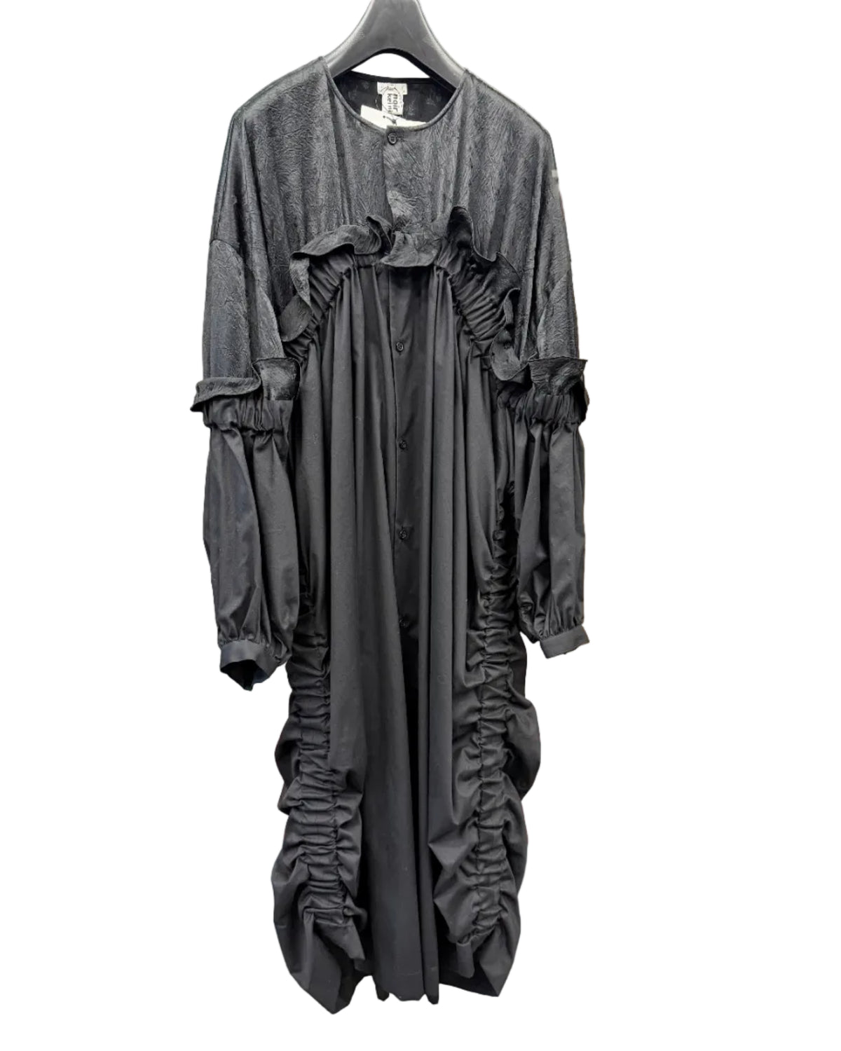 Front view of noir kei ninomiya black shirt dress with gathered ruffles and textured contrast panels
